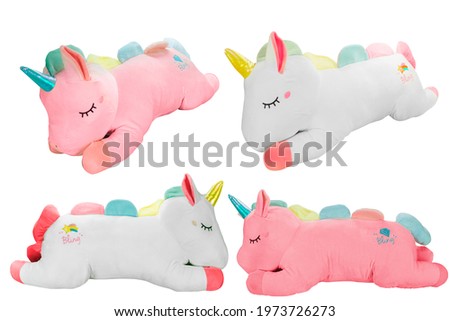 soft unicorn plush toy with wings and fluffy horn and for babies and girls isolated on white background as product photo