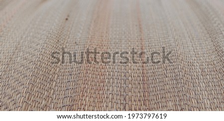 BANNER Real nature background. Blur effect. Close-up Woven method bamboo cane straw pattern texture mat. East Asia traditions. Calm spa warm mood concept. Wheat beige tone collection in stock