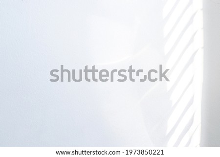 Architectural shadows. Sunlight architecture abstract background with light, black shadow overlay from window on white texture wall. Mockups, posters, stationary, wall art, design presentation