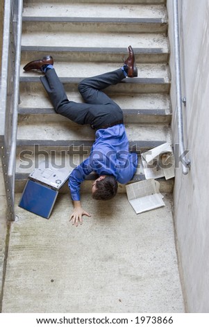 Clumsy business man falling down stairs.
