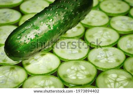 Fresh sliced cucumber and cucumber close-up. Fresh organic vegetables