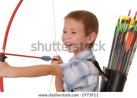 Young boy with bow and arrow practicing archery Royalty-Free Stock Photo #1973911