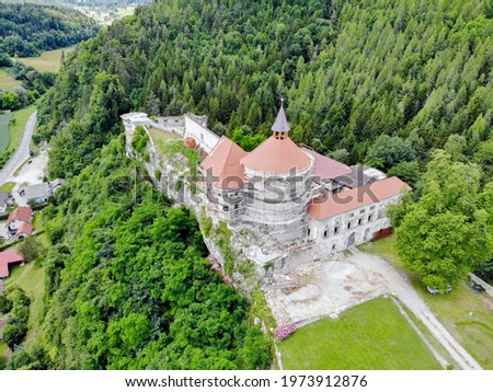 Lemberg castle in Slovenia from air in 2020, the entire castle complex is situated on a rocky cliff above the valley