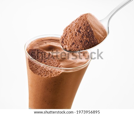 Chocolate mousse spoon and Chocolate mousse glass on a white background Royalty-Free Stock Photo #1973956895