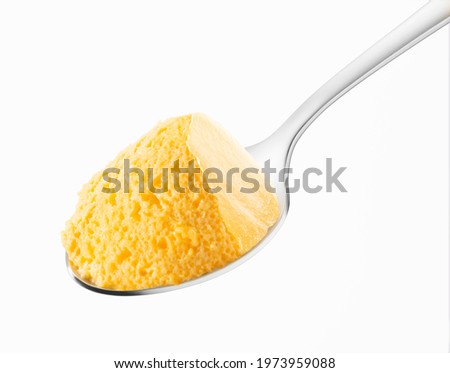 Apricot mousse spoon on a white background Royalty-Free Stock Photo #1973959088