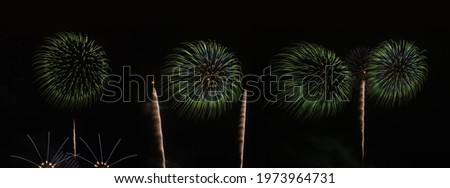 International fireworks festival display at night. Variety of colorful fireworks in holidays celebration isolated on black. Happy New Year Background.
