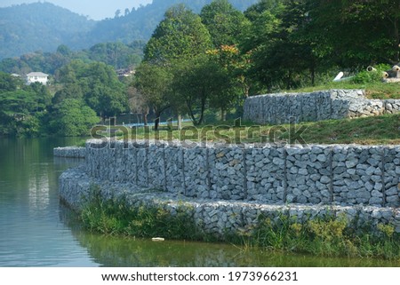 Pictures of gabion wall constructed on a lake side.