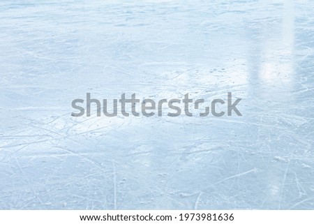 COLD ICE BACKGROUND, ICE HOCKEY STADIUM WITH SCRATCHED ICY SURFACE AND LIGT REFLECTIONS, WINTER SPORT FIELD WITH EMPTY SPACE