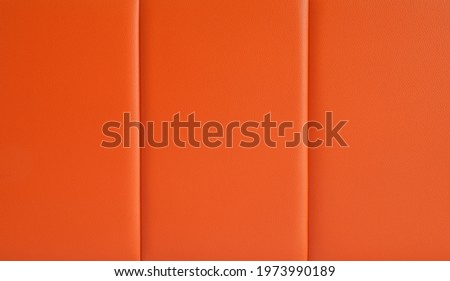 Closeup of seamless orange leather texture for background