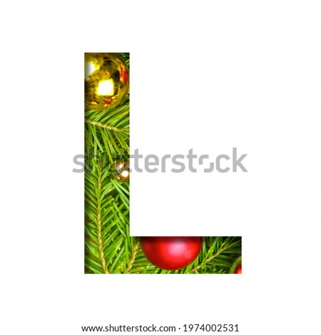 Alphabet on Christmas tree. The letter L cut out of paper on a background fresh Christmas tree with colored balls. Set of decorative holidays alphabet fonts.