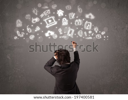 Business man looking at modern icons and symbols concept