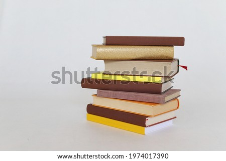 Stack of books on green background