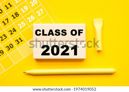 class of 2021. calendar and WOODEN BARS with informationon on the a yellow background desktop .