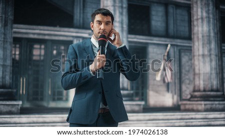 Anchorman Reporting Breaking News Live Outside an United States of America Parliament, Court or Other Government Building with Columns. Newsreader Delivers Journalistic Program on Television. Royalty-Free Stock Photo #1974026138