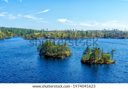 A beautiful forest lake called the Stone Lake in Tyresta National Park, Sweden.  Royalty-Free Stock Photo #1974045623