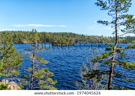 A beautiful  forest lake called the Stone Lake in Tyresta National Park, Sweden.  Royalty-Free Stock Photo #1974045626