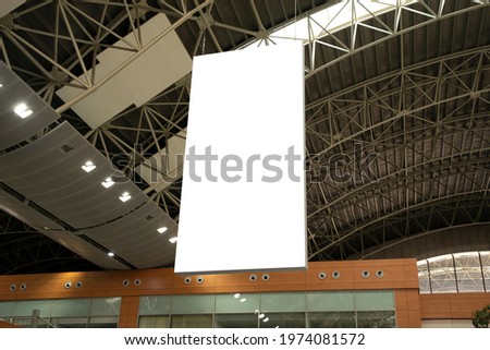 Vertical billboard hanging in the airport