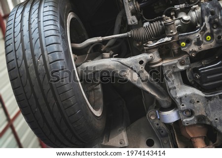 Close-up of car front suspension system components. Royalty-Free Stock Photo #1974143414