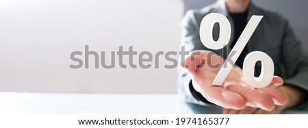 Discount Percentage Sign. Hand Showing Discount Percent Royalty-Free Stock Photo #1974165377