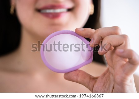Diaphragm Vaginal Contraceptive Ring. Spermicide Contraception And Birth Control Royalty-Free Stock Photo #1974166367