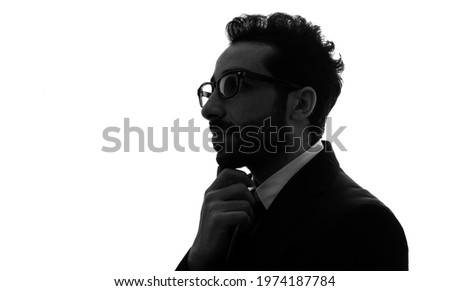 Silhouette of thinking arabian businessman. Royalty-Free Stock Photo #1974187784