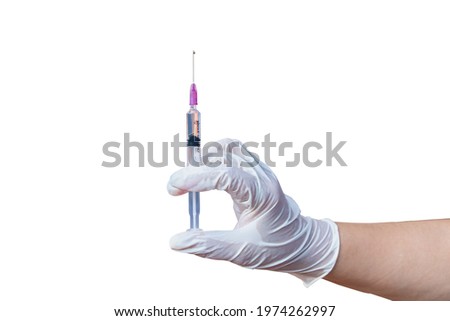 Hand in rubber gloves holding a plastic syring with liquid for injection isolated on white background. Health care, treatment concept
