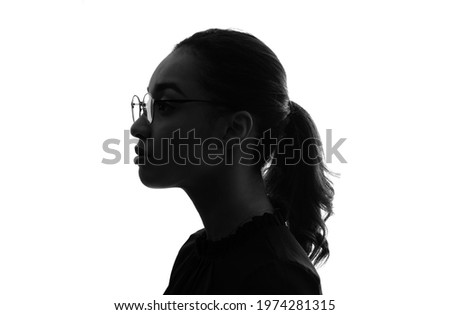Silhouette of thinking black woman.