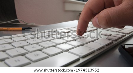 view of finger pressing enter key