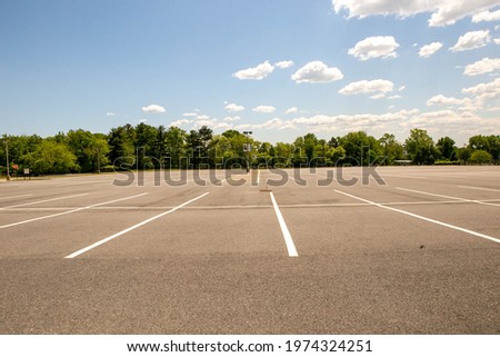 These are photos of a parking lot.  Royalty-Free Stock Photo #1974324251