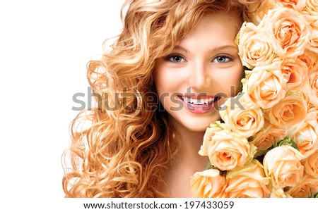 Beauty teenage model girl with curly long hair and bouquet of beautiful roses. Blonde young woman portrait closeup. Isolated on white background. Holiday Hairstyle and makeup