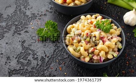 Macaroni Salad with red bell pepper, onion, celery, gherkins and mayonnaise dressing Royalty-Free Stock Photo #1974361739