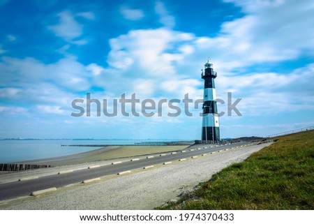 Breskens lighthouse on a partially cloudy day