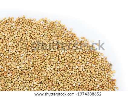 Dried buckwheat on a white background. Healthy food. Top view.