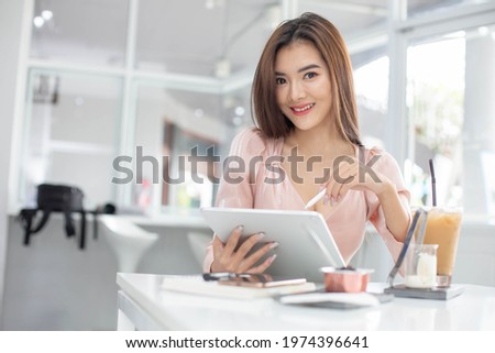 Asian women are using computers to work at home. According to the government's policy of working at home Caused by the Covid virus
