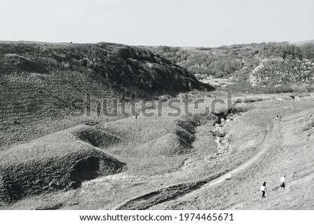 Monochrome photograph of Nash Point in Llantwit Major, South Wales.  The high cliffs and pathways to the beach form part of the Welsh coastal path and a popular area of outstanding natural beauty.