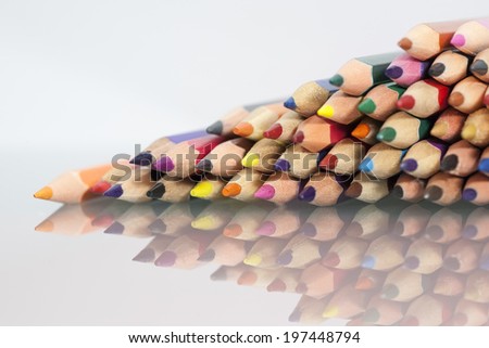 Group of sharp colored pencils with reflexions 