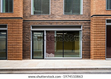 Office Shop front empty window brick wall terrace mockup Royalty-Free Stock Photo #1974510863
