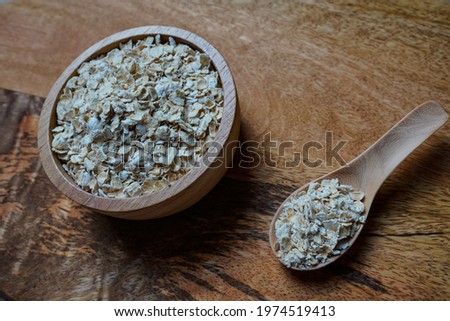 Oats placed in wooden utensils. Traditional European breakfast. Natural rustic theme. Healthy Lifestyle