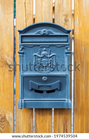Mail metal black mailbox postbox letter on wooden vertical background