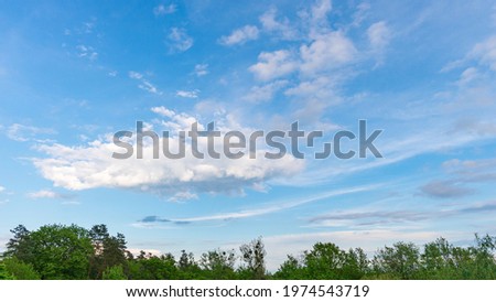 Panoramic view of a blue sky with big cloud on a beautiful spring day