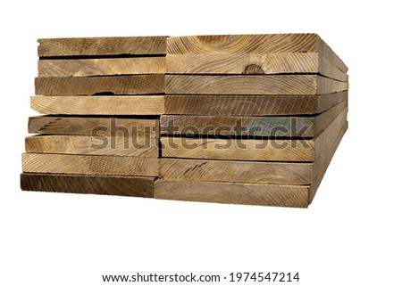 A pile of dark-tinted ash planks. Stacked planed boards. Isolated background.