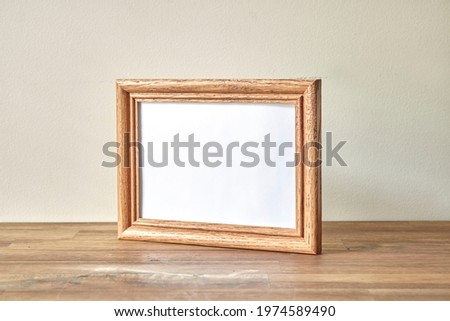 A studio photo of a timber photo frame
