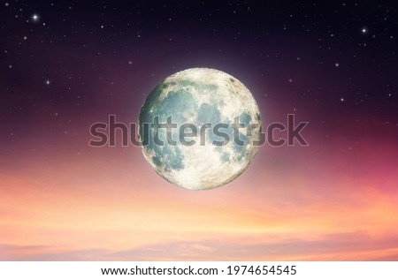 Full moon with night sky in the clouds ,Elements of this image furnished by NASA.

