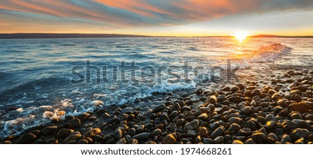 Scenic colorful sunset at the sea coast. Good for wallpaper or background image. Beautiful nature landscapes Royalty-Free Stock Photo #1974668261