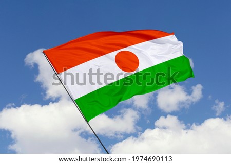 Niger flag isolated on sky background with clipping path. close up waving flag of Niger. flag symbols of Niger.