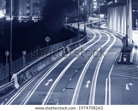 Light trails of traffic on road at night. Transportation background