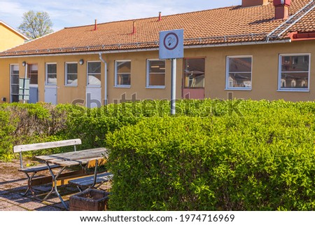 Landscape view of rest place with No smoking sign near hospital. Sweden.