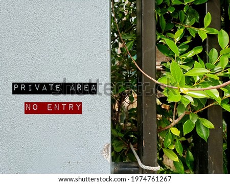Wall background with text sign PRIVATE AREA NO ENTRY - residents and tenants privacy protection by a sign to prevent unwanted visitors in house ,apartment, condominium , hotel or private area