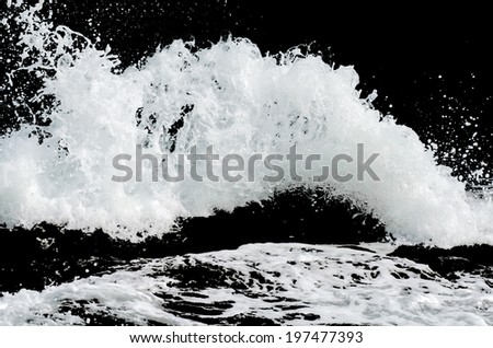 Water wave splashes, isolated on black background Royalty-Free Stock Photo #197477393