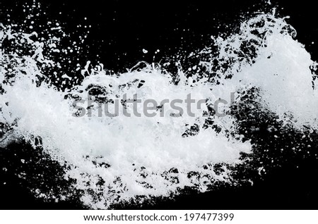 Water wave splashes, isolated on black background Royalty-Free Stock Photo #197477399